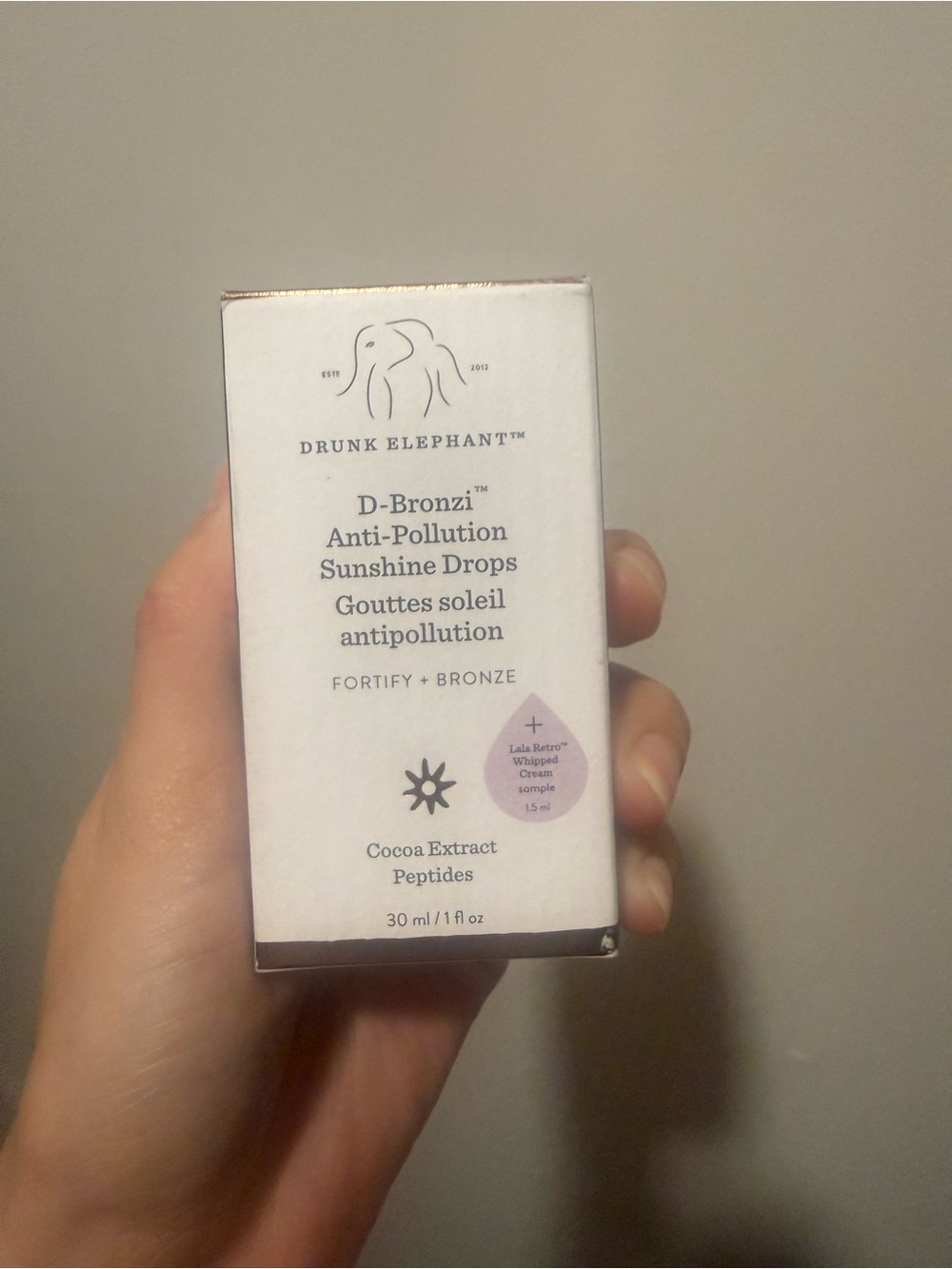 Drunk Elephant D-Bronzi Sunshine Drops Box with White and Pale Pink Accents